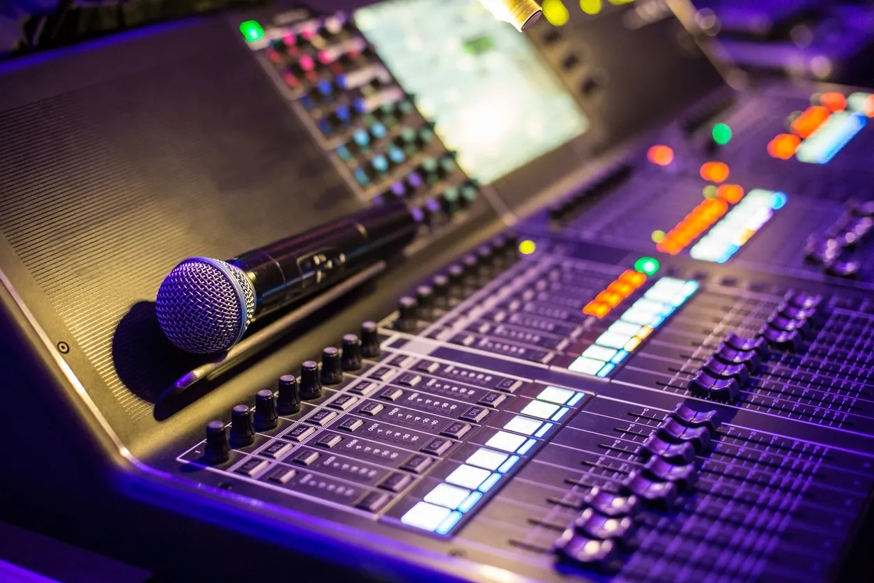 A microphone and some sound board equipment